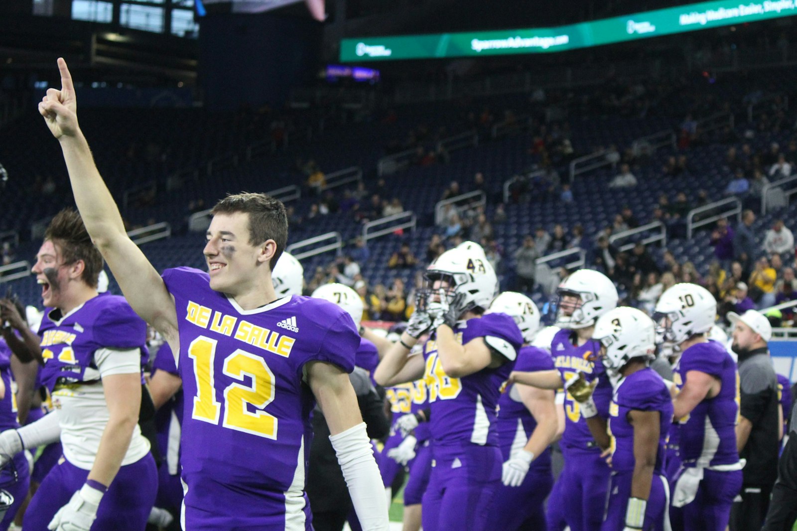 Quarterback Brady Drogosh (12) paced De La Salle’s offense by throwing three touchdown passes and rushing for another, for a total of 316 yards.