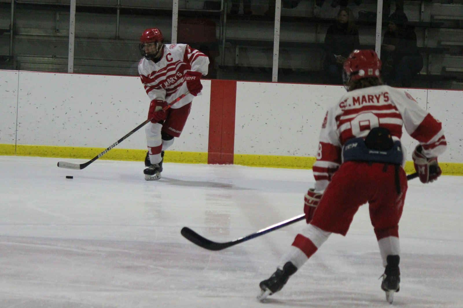 Team captain Dylan Magdich spots St. Mary’s teammate Reiss Williams open for a pass. Williams later scored a power-play goal, pacing the Eaglets to a 2-0 victory over Brother Rice.